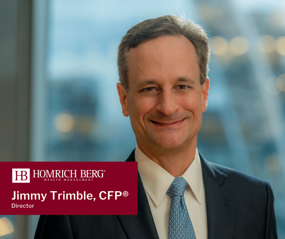 A person in a suit smiles at the camera with a blurred cityscape background. A red banner displays Homrich Berg Wealth Management and reads Jimmy Trimble, CFP®, Director.