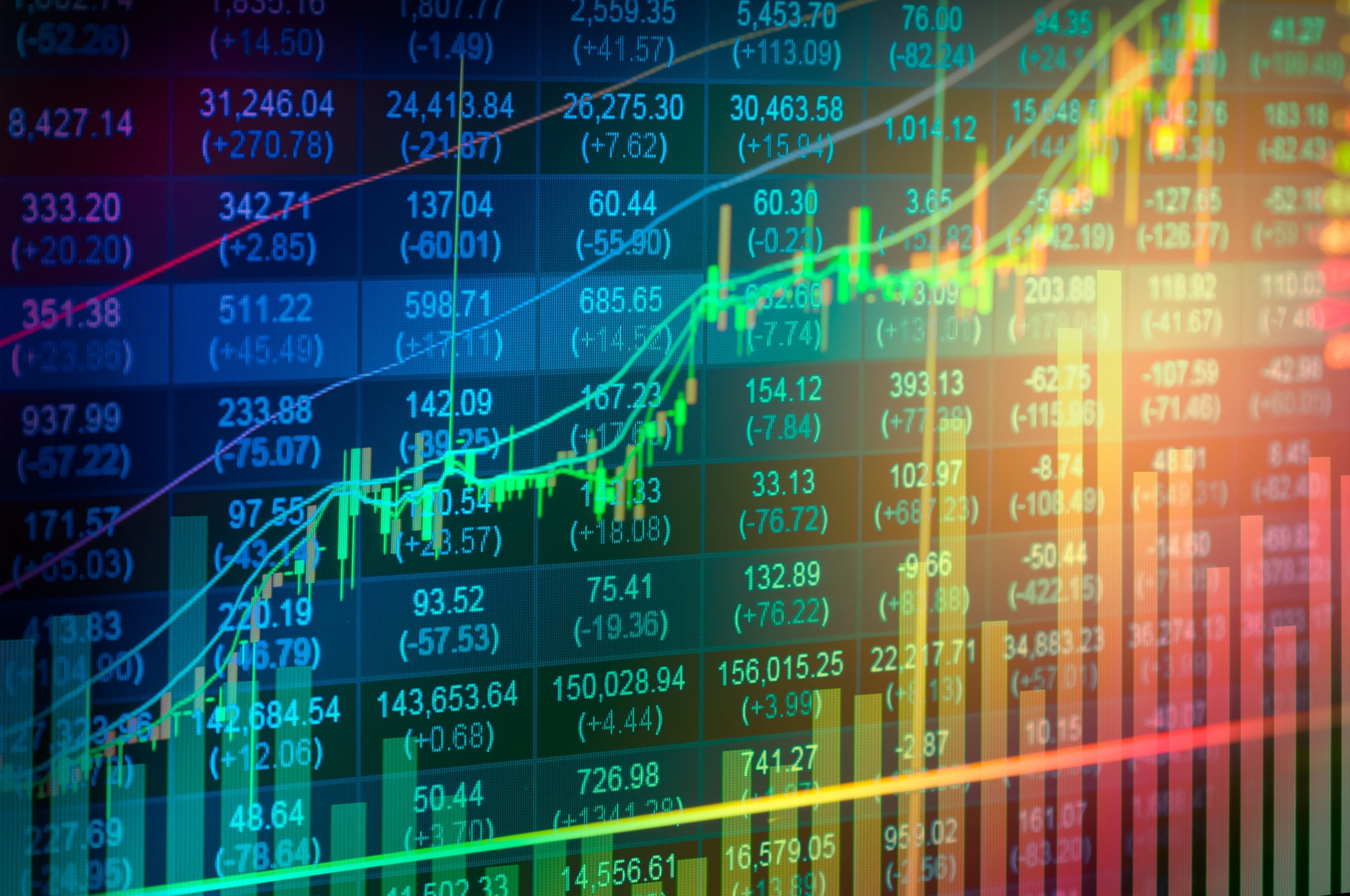 A colorful digital stock market display shows fluctuating graphs, numbers, and bar charts, indicating various financial data trends on a dynamic screen with bright, multicolored lines overlaying the information.