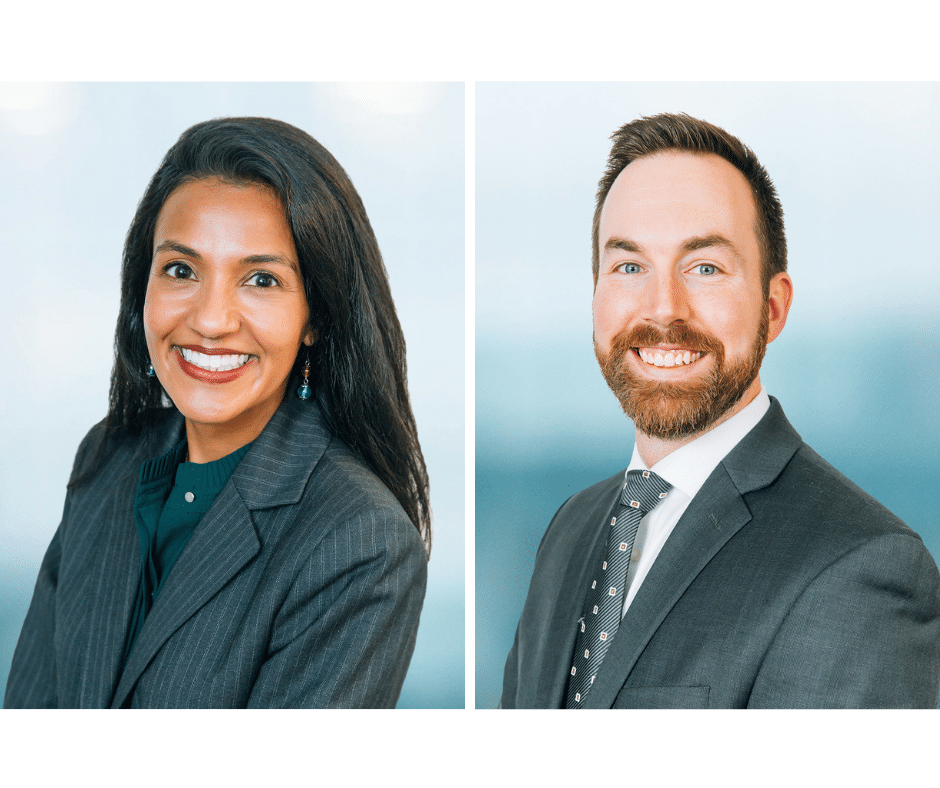 Two professionals in formal attire are smiling, each in separate portraits. The woman on the left has long dark hair and wears a striped suit. The man on the right has short hair and a beard, wearing a suit and polka dot tie. Blue background.