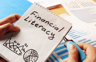 Notepad with Financial Literacy written on paper