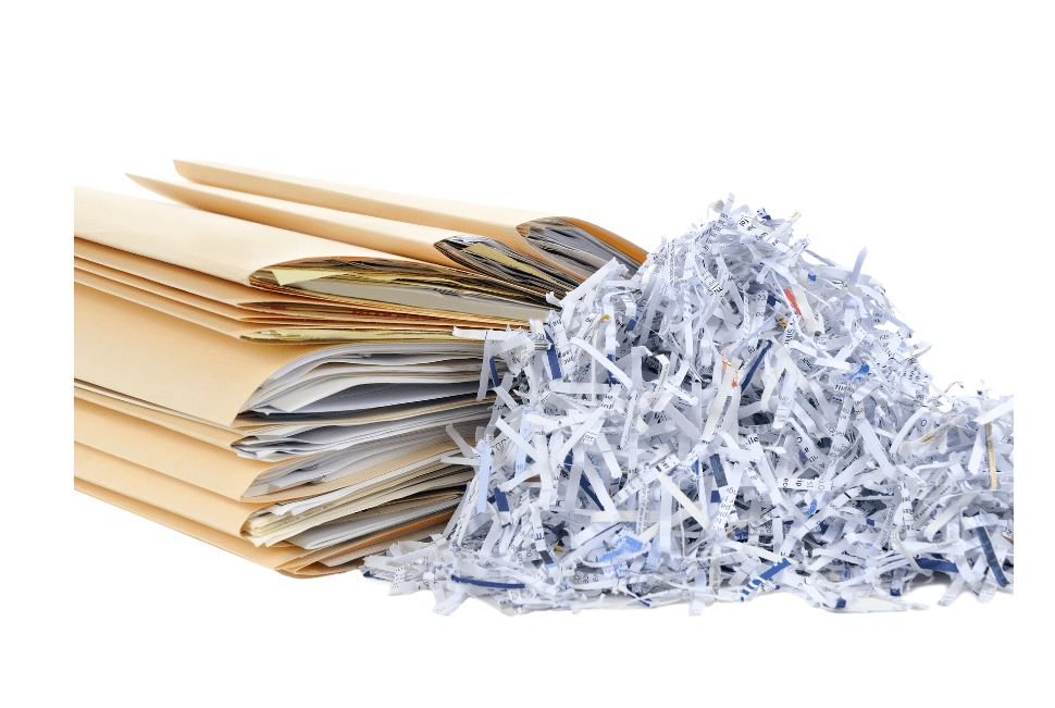 A stack of brown file folders filled with papers, next to a pile of shredded paper strips on a white background.