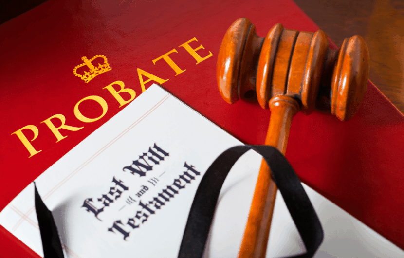 A gavel rests on a red document labeled Probate with a crown symbol. Next to it, a folder titled Last Will and Testament is partially visible.