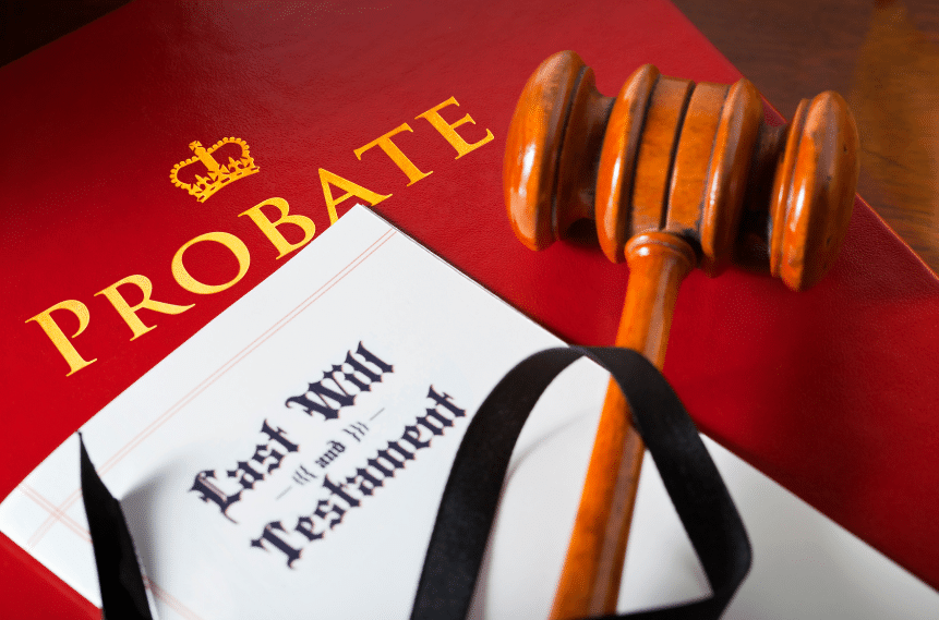 A gavel rests on a red document labeled Probate with a crown symbol. Next to it, a folder titled Last Will and Testament is partially visible.
