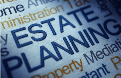 Close-up of assorted financial and legal terms printed in blue and orange text. The words ESTATE PLANNING are prominently featured in bold blue letters in the center.