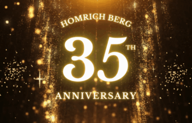 Glowing gold text reads “Homrich Berg 35th Anniversary” against a sparkling, festive golden background with falling glitter and light effects.
