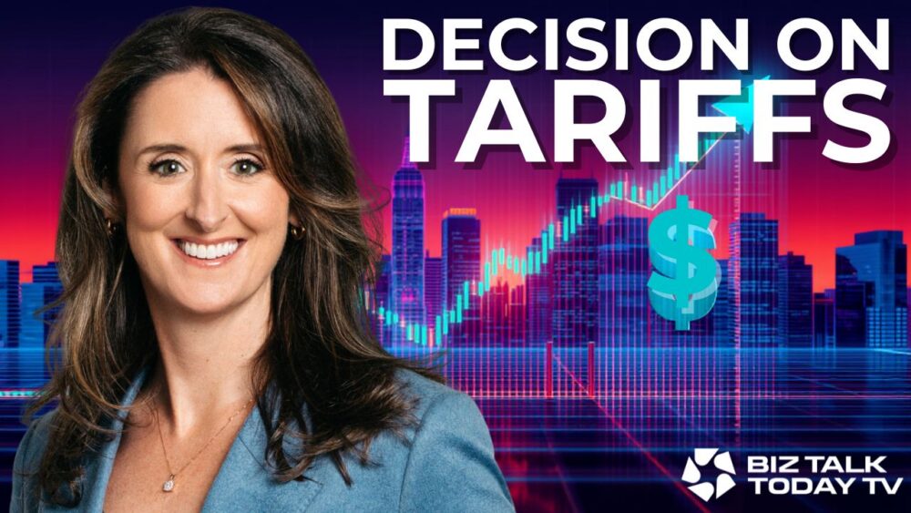 A smiling woman in a blue blazer stands in front of a city skyline with digital financial graphics. Large text reads Decision on Tariffs. The Biz Talk Today TV logo is in the bottom right corner.