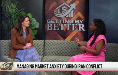 Two women sit on a couch in a TV studio, engaged in conversation. A sign behind them reads GETTING BY BETTER. The news ticker below says, Managing market anxiety during Iran conflict.