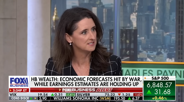 A woman with long brown hair in a plaid blazer speaks in a TV studio. A news banner reads: HB Wealth: Economic forecasts hit by war, while earnings estimates are holding up. Stock tickers scroll along the bottom.