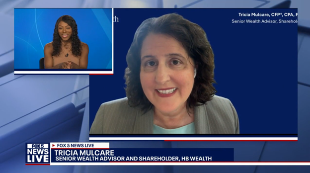 Screenshot of a FOX 5 News Live broadcast. The main screen shows Tricia Mulcare smiling, identified as a senior wealth advisor. An inset shows the news anchor, also smiling, against a blue background.